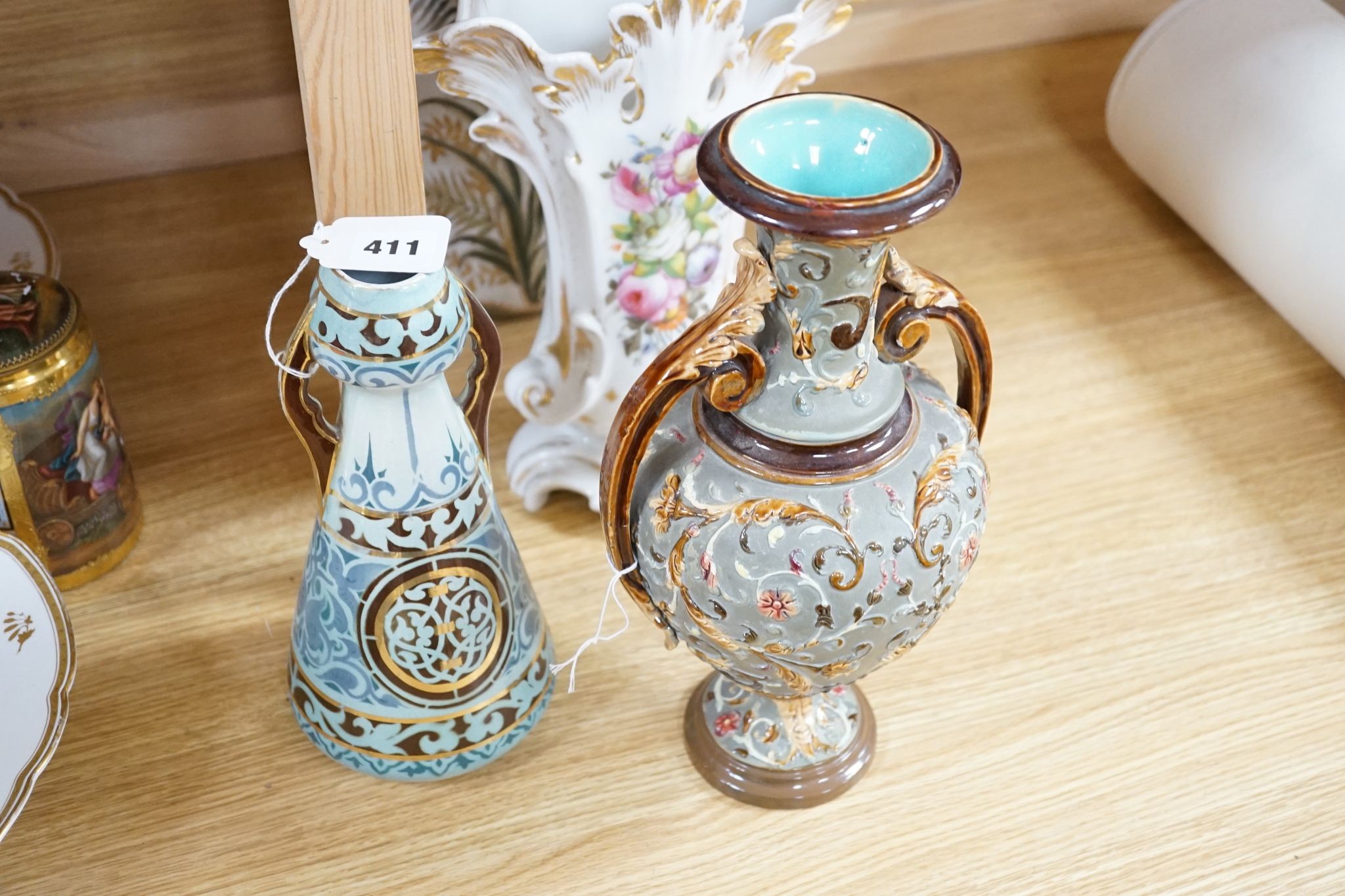 Four pairs of continental porcelain vases including a pair of Wilhelm Schiller & Sons vases